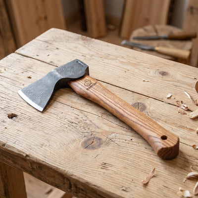 The AX1 on a workbench with wood shavings
