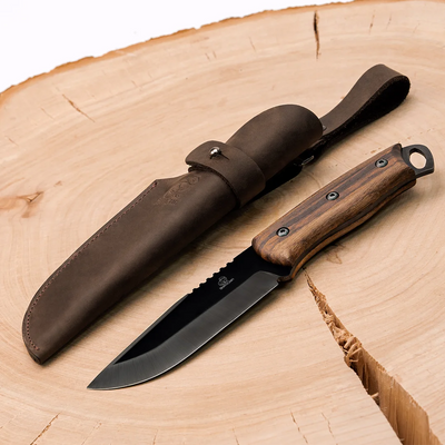 The BSH4 knife and its leather sheath on a wood slab