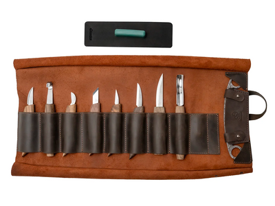 The S18X+ leather roll open with the tools in their slots, the drawknife and the strop